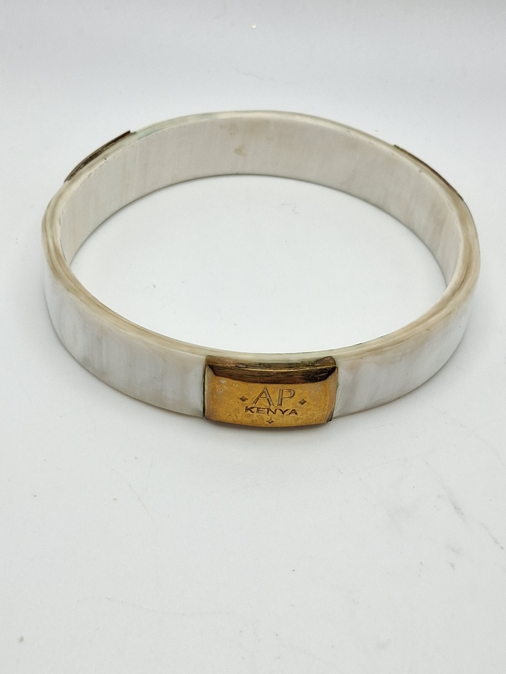 PM351.  AP Kenya White and Gold Bangle Bracelet